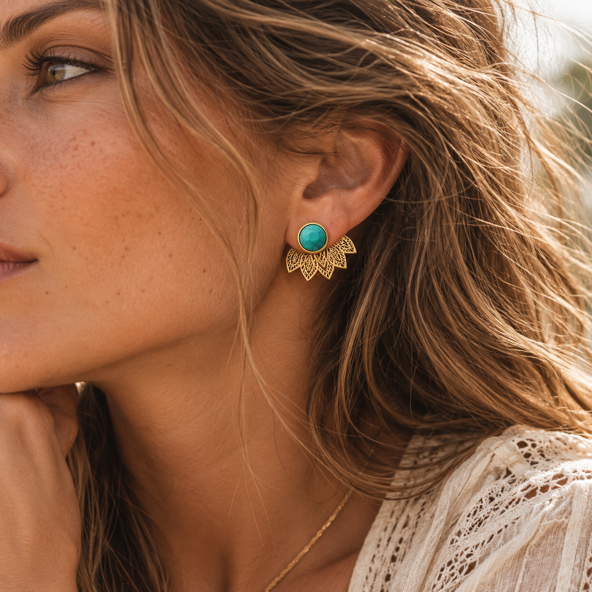 Turquoise Lotus Earrings worn with lotus behind earlobe